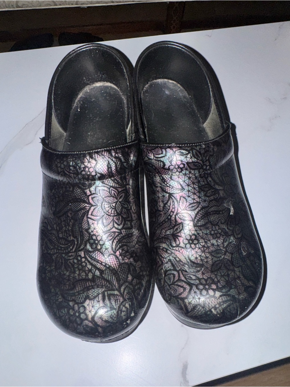 Dansko Black Iridescent Floral Clogs